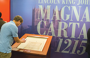 Visitors tour the Library of Congress new exhibit, Magna Carta: Muse and Mentor, in Washington, D.C.