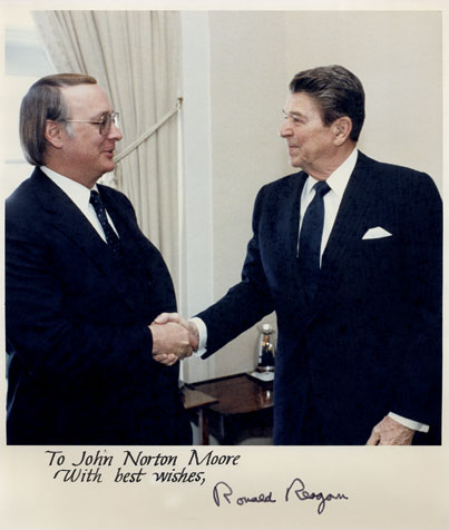 John Norton Moore shakes hands with President Ronald Reagan