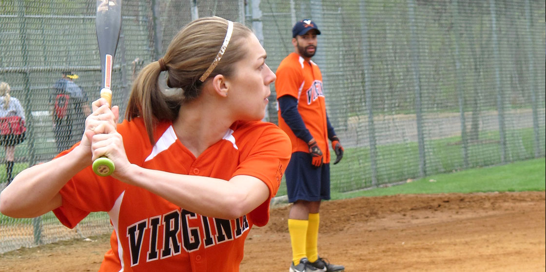 Student playing softball