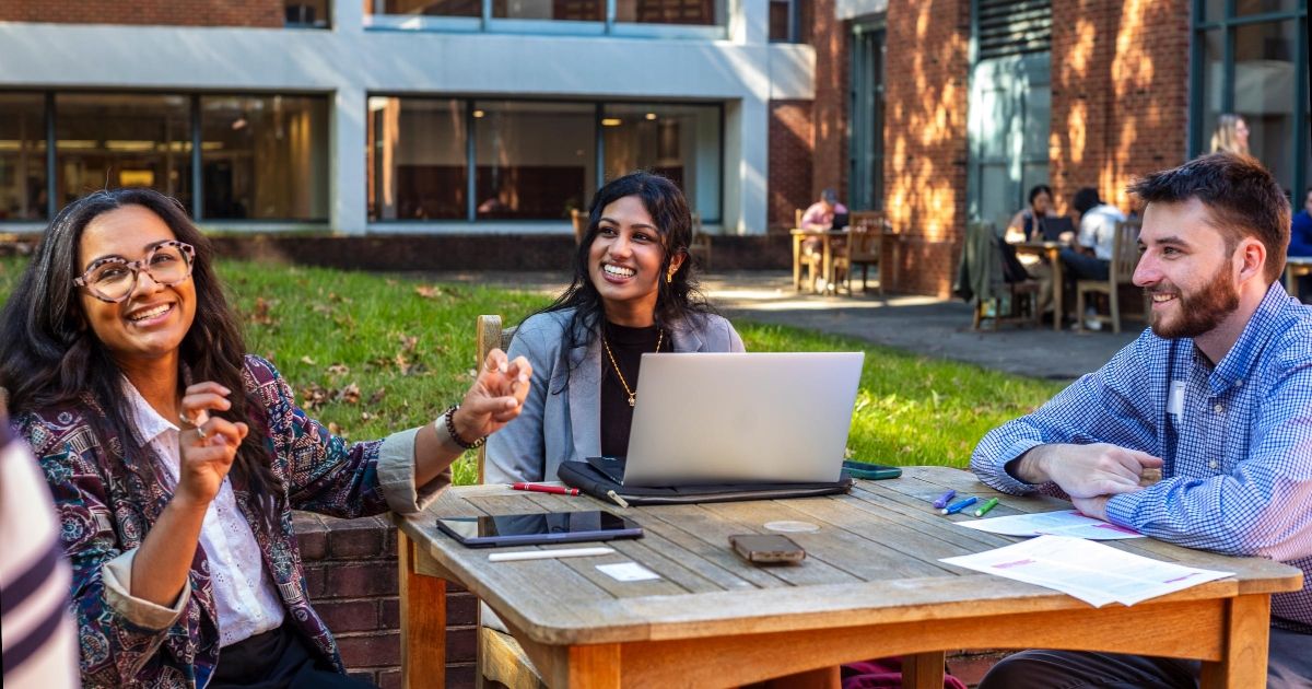 Students talk outside in Spies Garden