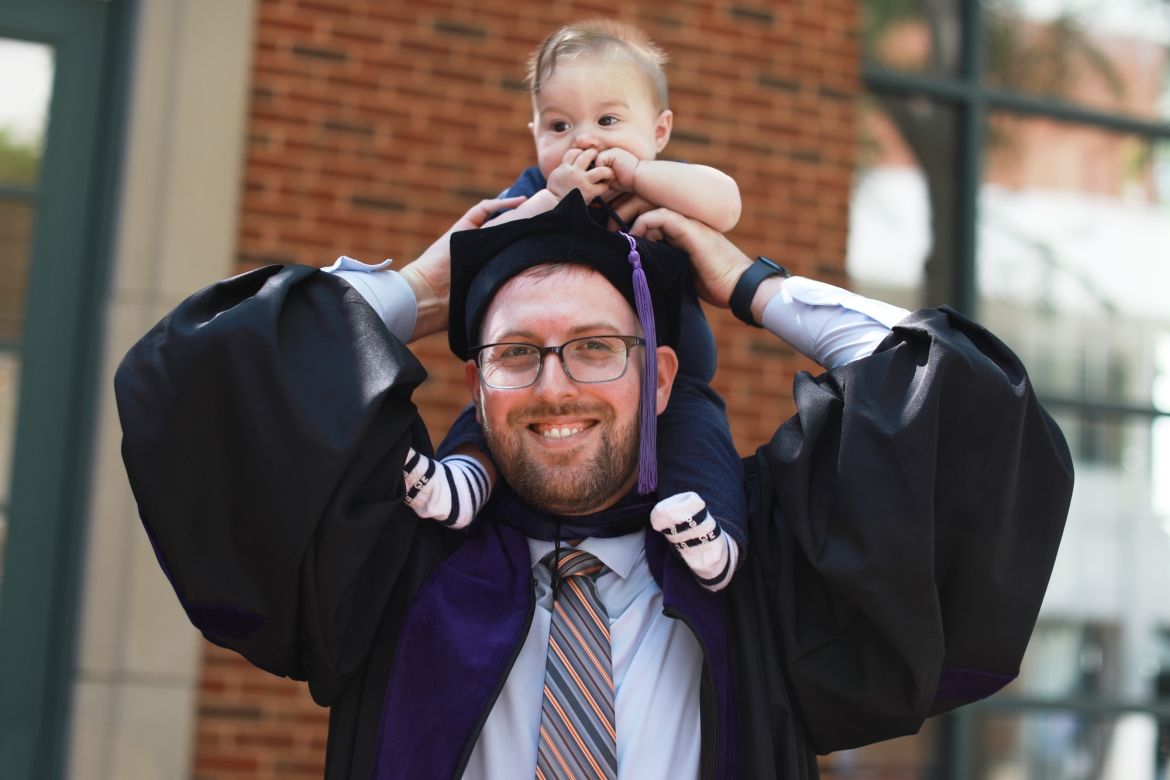 Graduate and child