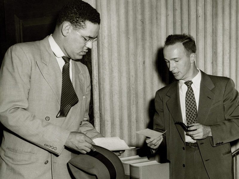 Swanson consults with Assistant Law Dean Charles Woltz