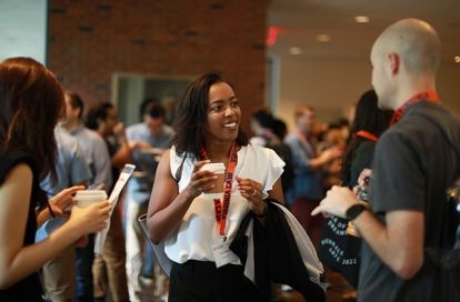 Students talk during orientation.