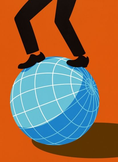 man balancing on globe