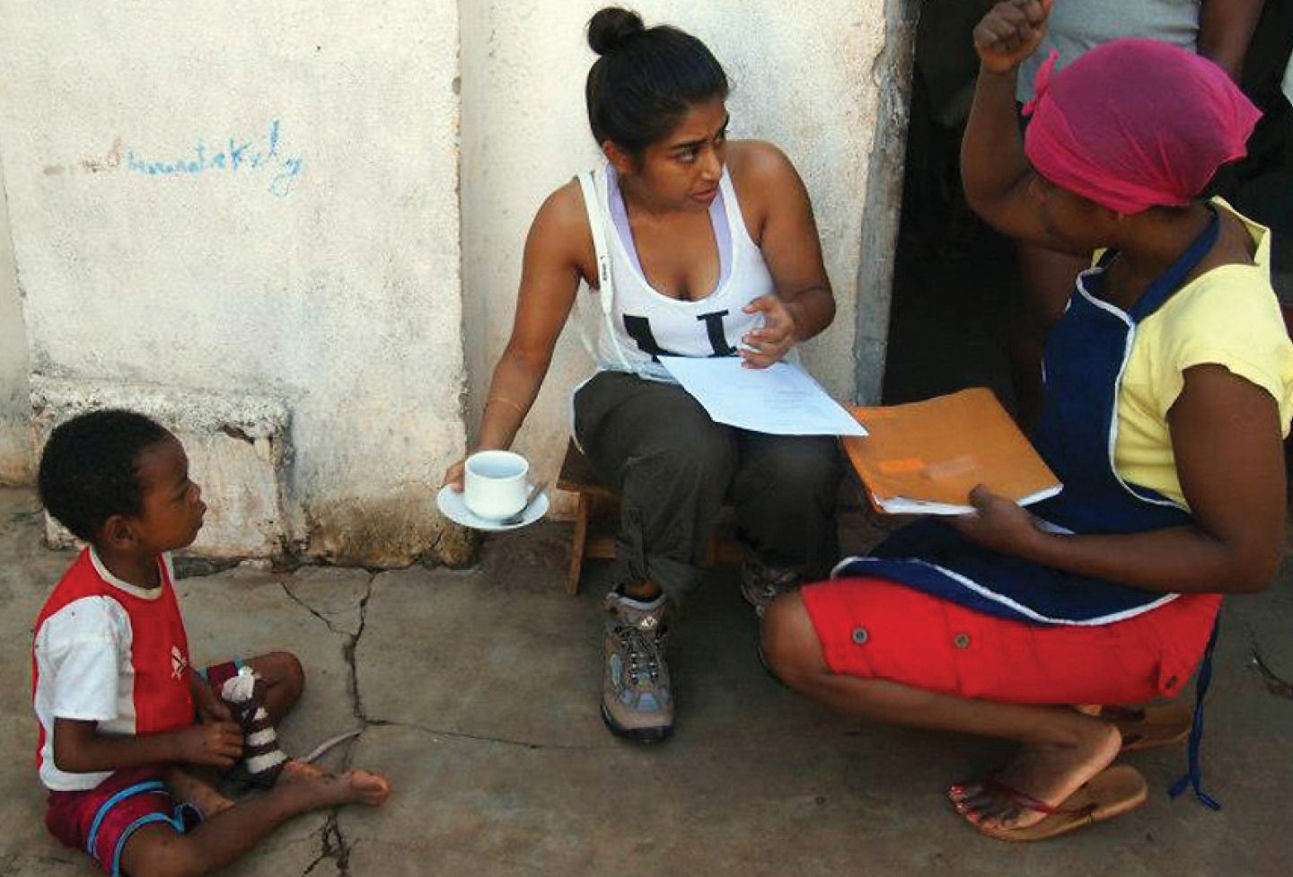 Sabrina Talukder ’14 (left) interviews a hotel owner about her personal experience with sex trafficking during a 2013 Human Rights Study Project trip to Madagascar. 