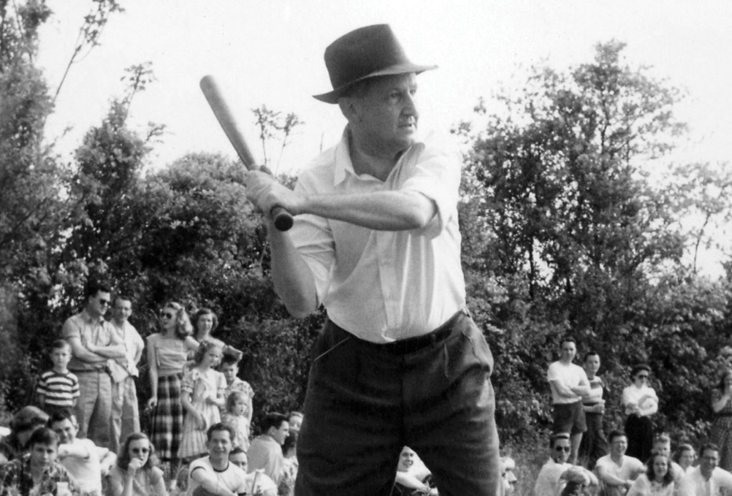 Dean F.D.G. Ribble ’21 plays softball with students and faculty in the early 1950s. 