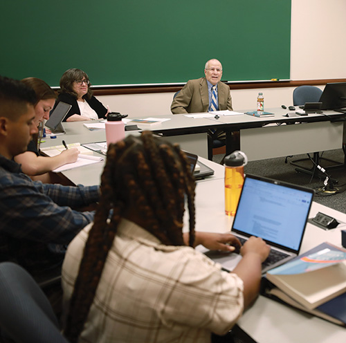 Professor Bobbie Spellman and Frederick Schauer lead a class with Roadmap Scholars