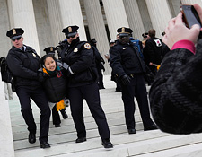 Protester and police