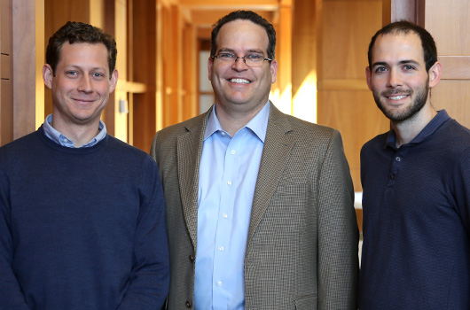 Dotan Oliar, center, K. Ross Powell ’15, left, and economics Ph.D. student Nathanial Pattison
