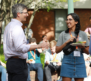 Vice Dean Michael Gilbert talks to a student.