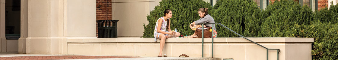 Students talk in front of the Law School