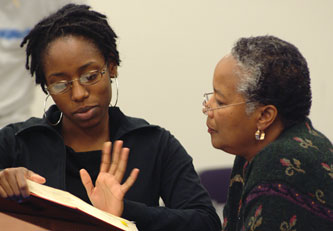 Gigi Parris and Mildred Robinson speak during class