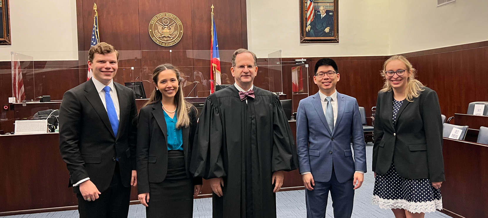 Daniel Richardson, Natalia Heguaburo, Daniel Liu and Katrina Meyer pose with Chief Judge Raúl Manuel Arias-Marxuach