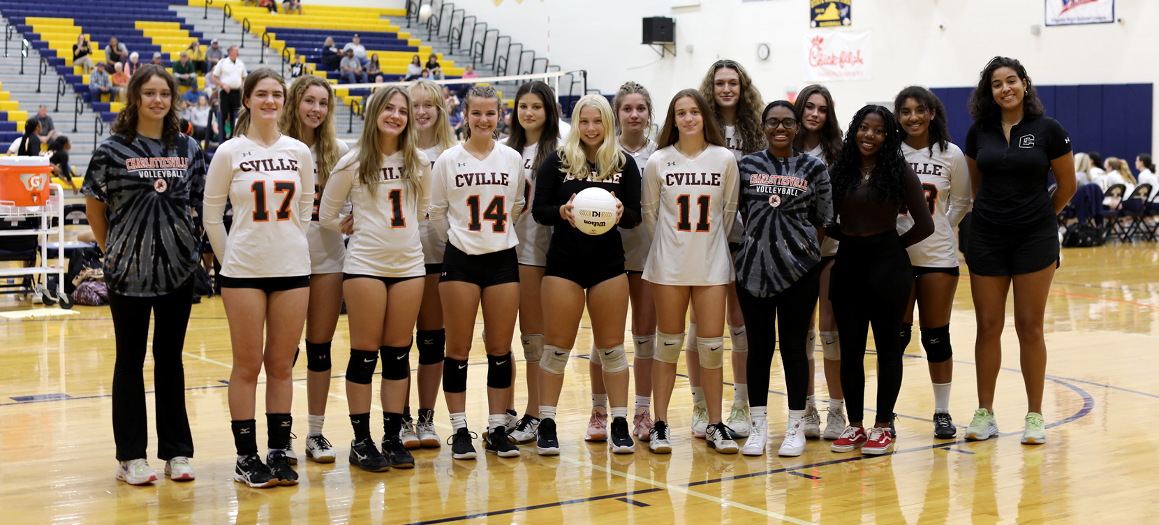 Peters, pictured with the Charlottesville High School varsity volleyball team, said working with young athletes has been a highlight of her time in Charlottesville.