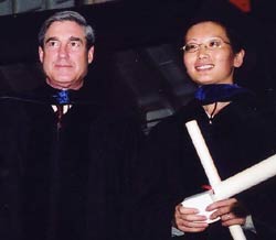 Director Mueller with a graduating student
