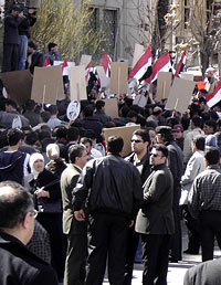 A pro-government rally in Syria included members of the secret police.