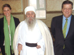 Erin Houlihan '11, left, in Iraq with Osama Al-Nujaifi, the speaker of the Iraqi Parliament, and William Spencer, right.