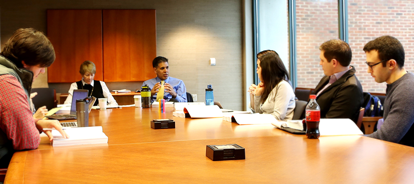 Thapar, third from left, teaches a class.