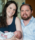 Daniel and Mary Robinson Hervig with their baby.