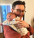 Tom McGough and a baby